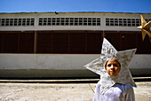 A student from Rivas Davila Elementary school participates in a traditional holiday procession on January 22, 2008 in Merida, Venezuela. Students paraded through their neighborhood dressed in nativity scene and villager costumes, stopping at private homes