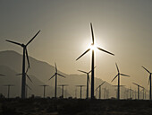 Windmills for electric power at work, near Palm Springs, California, United States of America.