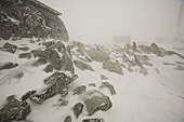A group of people experiences the elements while on a Mount Washington Observatory educational winter program on the summit of Mt. Washington, NH.