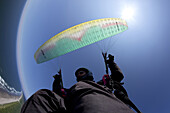 Brad Hill throwing some spiral turns while paragliding high above Sunset Beach near Seaside, Oregon.