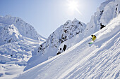 Seth Morrison skis down a deep snow covered slope in Haines, AK