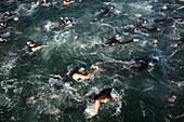 'Competitors start a Swim Leg for the ''Beach to Battleship'' Ironman Triathlon, held in Wrightsville Beach and Wilmington, NC.'