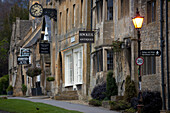'The main street of Boradway, England.  ''One of the best loved of all Cotswold villages, Broadway's popularity is long lived. It developed as a staging post on the route between Oxford and Worcester, where coaches and horses could rest at the Lygon Arms 