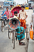 'Dhaka,  Bangladesh - July 2011: Loudspeaker on a rickshaw.  With over 400, 000 rickshaws running the streets on Dhaka every day the Bangladeshi capital has been described as the ''Rickshaw capital of the world.'