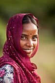 Srimangal,  Bangladesh - August,  2011: Portrait of a young girl working in a tea plantation outside Srimangal in Bangladesh.