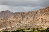 India, Jammu and Kashmir, Ladakh. Shanti Stupa as seen from The Namgyal Tsemo Gompa, a Buddhist monastery in Leh district, Ladakh, Northern India.The structure is a Buddhist white-domed stupa chorten, on a hilltop in Chanspa, Leh district, Ladakh, in the 