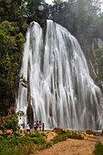 Tourists flock to a waterfall near the town of El Lemon.