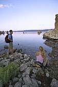 Jens Martin and Katrin Griebeling standing at the shores of Mono Lake at the Mono Lake Tufa State Reserve. California, USA.