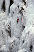 Steve Giddings makes his way up a frozen waterfall at the Ouray Ice Festival in Ouray, Colorado. Ice climbers require ice axes, crampons, rope and harness as well as a great deal of balance and focus. The Ouray Ice Festival is located in the Uncompahgre G