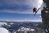 A man skiing off a cliff above Donner Lake California.  Bill Stevenson / Aurora Photos 