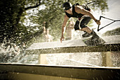 Toronto , ON - August 13 :  Wakeboard stunt rider performs a railslide.  Photo by Paul Giamou / Aurora 