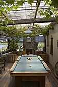 A beautiful patio with a pool table and grapevine growing on the ceiling in Carmelo, Uruguay.  releasecode: THS_0001