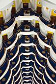 Tiers of guest floors are part of the spectacular and luxurious interior of the Burj al Arab Arabian Tower, the world's tallest  hotel at 321 meters, on the beach along the Persian Gulf, Dubai, United Arab Emirates.  A super luxury hotel, the Burj al Arab