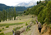 A group of people ride on horseback in Futaleufu, Chile.
