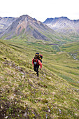 Joe Stock hiking up to Windy Pass for a packrafting trip on the Sanctuary river, Denali National Park, Alaska.