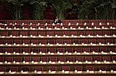 A delegate makes a call on a mobile phone in the Great Hall of the People before a session of the National People's Congress, China's Parliament.