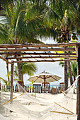 Hammocks hang on the beaches of Isla Mujeres, near Cancun, Mexico. The area is known for it's beautiful beaches, first-class resorts and outdoor, nautical activities.