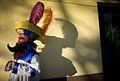 'A Chinelo dancer rests on the sidelines of carnival celebrations in Tlayacapan, Mexico, February 7, 2008.  Groups of Chinelos dance the ''Brinco del Chinelo,'' or the ''Chinelo Hop'' during Carnival. Spanish colonizers brought the tradition of Carnival t