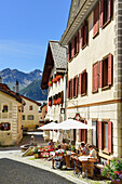 Guests in a pavement cafe, Guarda, Lower Engadin, Canton of Graubuenden, Switzerland