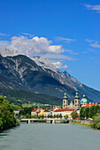 View over Inn river to Cathedral of St. James, Karwendel with mount Bettelwurf in background, Innsbruck, Tyrol, Austria