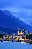 View over Inn river to Cathedral of St. James in the evening, Karwendel with mount Bettelwurf in background, Innsbruck, Tyrol, Austria
