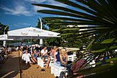 People enjoying a sunny afternoon at Schweinfurt city beach bar and lounge, Schweinfurt, Franconia, Bavaria, Germany