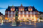 Market square with statue of Prince Albert of Saxe-Coburg and Gotha and Stadthaus, former chancery building at dusk, Coburg, Franconia, Bavaria, Germany