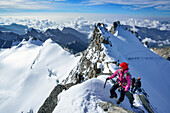 Woman ascending to summit of Gran Paradiso, Gran Paradiso, Gran Paradiso Nationalpark, Graian Alps range, valley of Aosta, Aosta, Italy