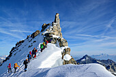 Several groups of persons standing on ridge of Gran Paradiso, Gran Paradiso, Gran Paradiso Nationalpark, Graian Alps range, valley of Aosta, Aosta, Italy