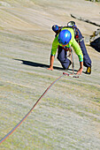 Woman climbing on granite slab, Sector Crow, Grimsel pass, Bernese Oberland, Switzerland