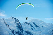 Paragliding below summit of Mont Blanc, Chamonix, Haute-Savoie, French Alps, France, Europe