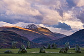 Castlerigg Stone Circle in autumn with the snow topped Helvellyn mountain range in the distance, Lake District National Park, Cumbria, England, United Kingdom, Europe