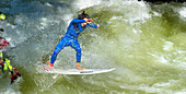Surfer on the Eisbach river in the English Gardens, Munich, Upper Bavaria, Bavaria, Germany