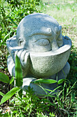 Stone statue in Japanese ornamental garden