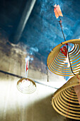 Incense burning in Chinese temple, low angle view, close-up