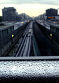 Water drops on rail overlooking traintracks