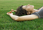 Woman lying in grass