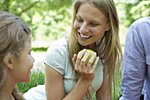 Woman enjoying picnic with her family