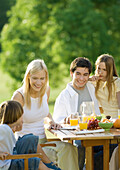 Family having breakfast outdoors
