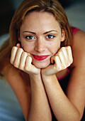 Woman leaning on elbows, portrait