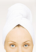 Woman with towel wrapped around head