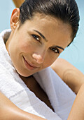 Woman with towel around neck smiling