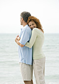 Mature couple, woman hugging man from behind