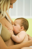 Woman breast feeding baby