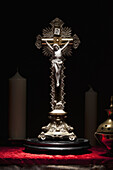 A brass crucifix on an altar