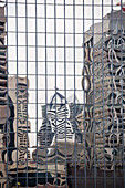 Buildings reflected in mirrored windows of office building, Brisbane, Australia