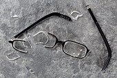 A broken pair of glasses
