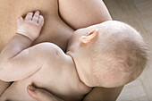 Mother breastfeeding her son