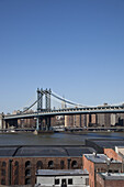 View over buildings with Williamsburg Bridge in the distance