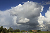 Cumulus clouds over landscape